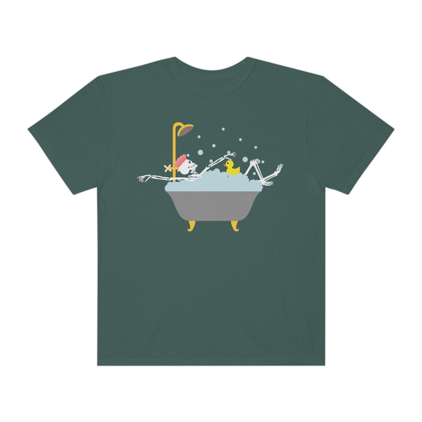 A woman wearing a cute green colored shirt with a female skeleton wearing a pink bath cap is taking a bubble bath with a yellow rubber ducky, the bath is gold and gray colored and the air is filled with bubbles.