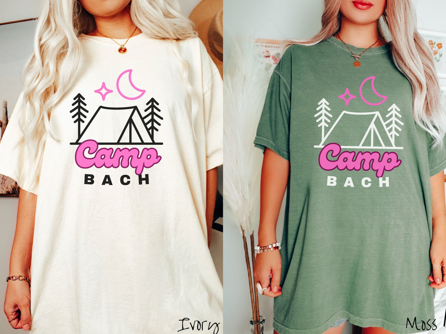 Two women wearing cute, vintage ivory and moss colored Comfort Colors t-shirts with text Camp Bach in pink and black font. Above the text is an outline of a tent in between two pine trees with a pink star and moon above in the sky.