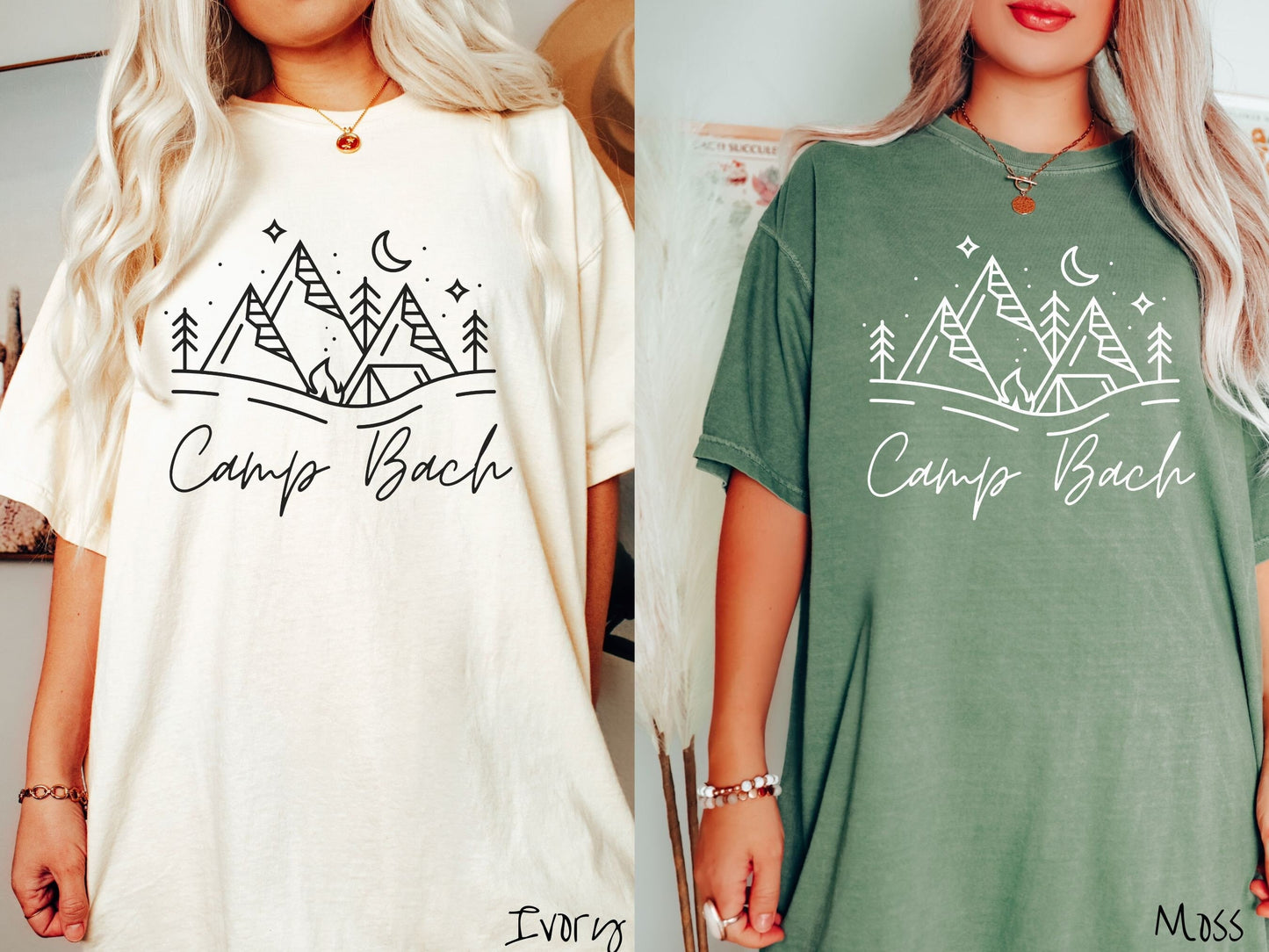 Two women wearing cute, vintage ivory and moss colored Comfort Colors t-shirts with text Camp Bach in white, cursive font. Above the text are outlines of mountains, trees, stars, a tent, campfire, and a stream.