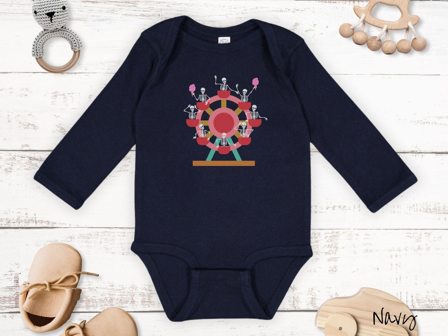 A cute navy colored body suit with a ferris wheel filled with black skeletons waving and holding cotton candy as they go around the ride.