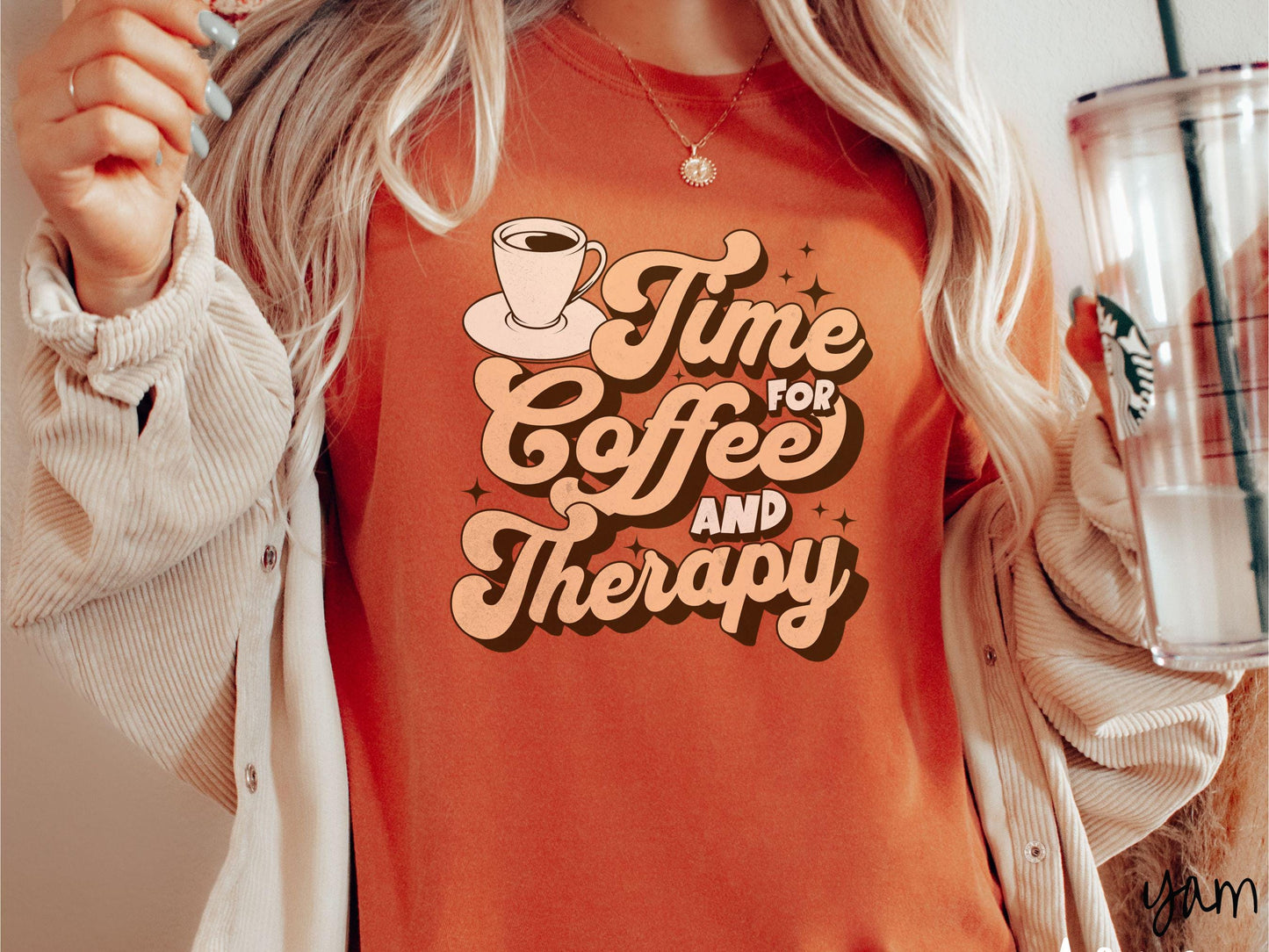 A vintage, yam colored Comfort Colors t-shirt featuring the text Time for Coffee and Therapy with a cup of coffee and stars in the background, giving off a cozy and comforting vibe.