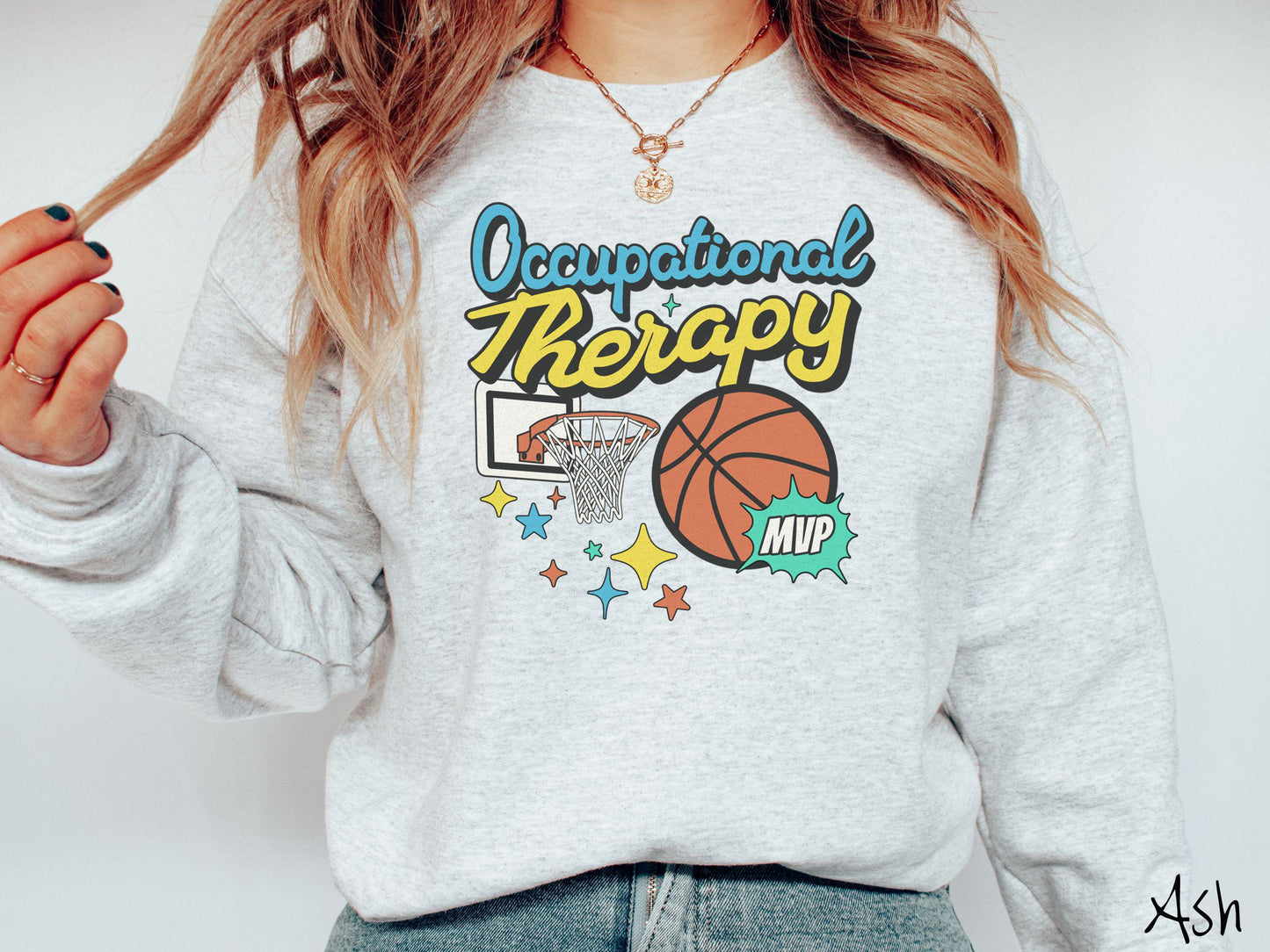 A vintage, ash colored Gildan sweatshirt features the phrase "Occupational Therapy" above a basketball goal, complemented by a bold basketball graphic with the text "MVP".