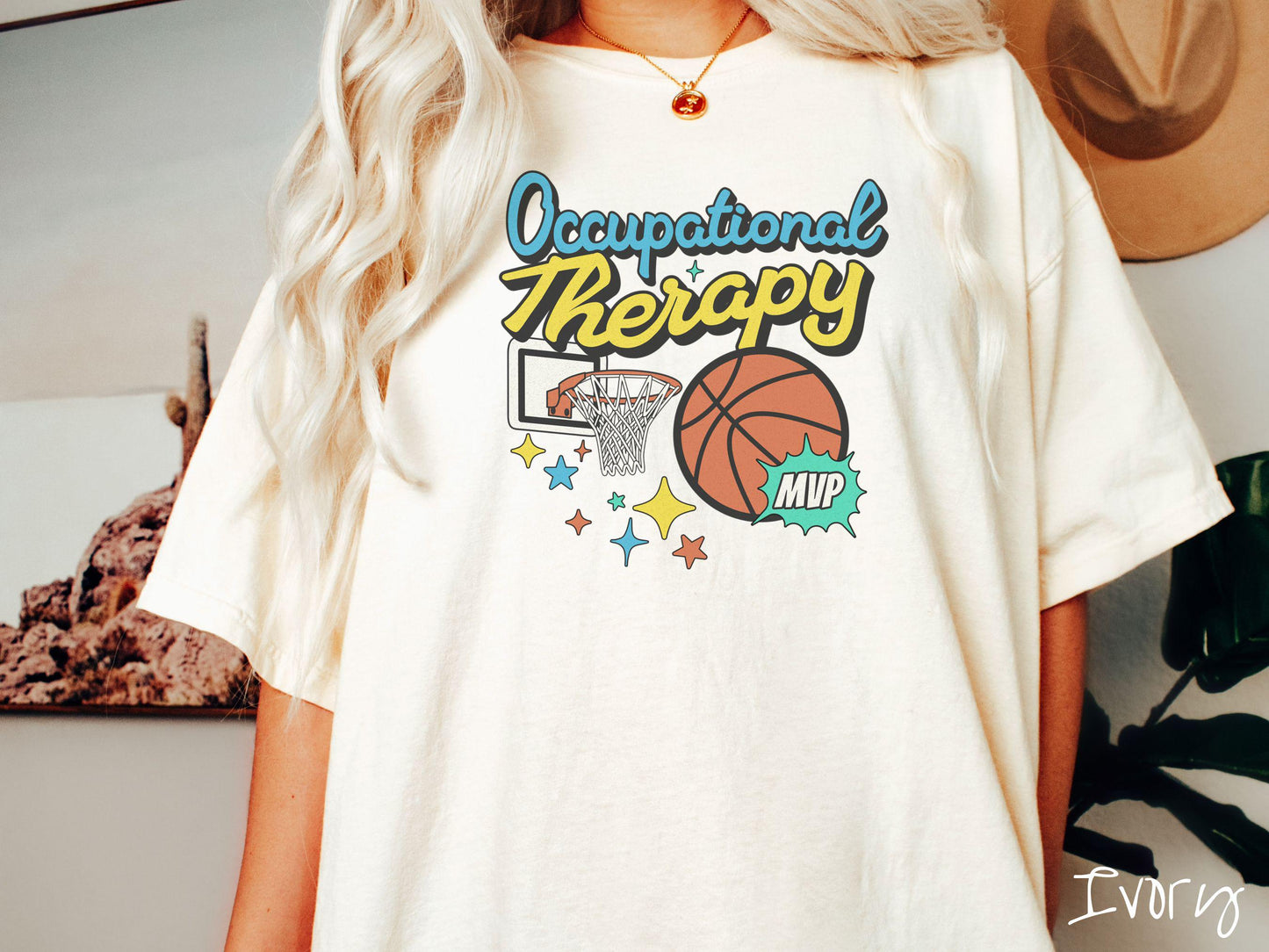 A vintage, ivory colored Comfort Colors T-Shirt features the phrase "Occupational Therapy" above a basketball goal, complemented by a bold basketball graphic with the text "MVP".