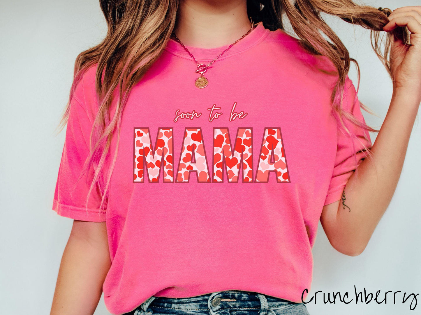 Celebrate your journey to motherhood with this vintage Comfort Colors t-shirt featuring the phrase “Soon to Be Mama” in bold red font, and the word “Mama” stands out in block letters filled with colorful hearts for a playful and charming touch.