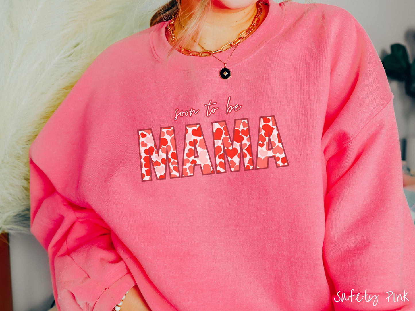Celebrate your journey to motherhood with this vintage Gildan sweatshirt featuring the phrase “Soon to Be Mama” in bold red font, and the word “Mama” stands out in block letters filled with colorful hearts for a playful and charming touch.