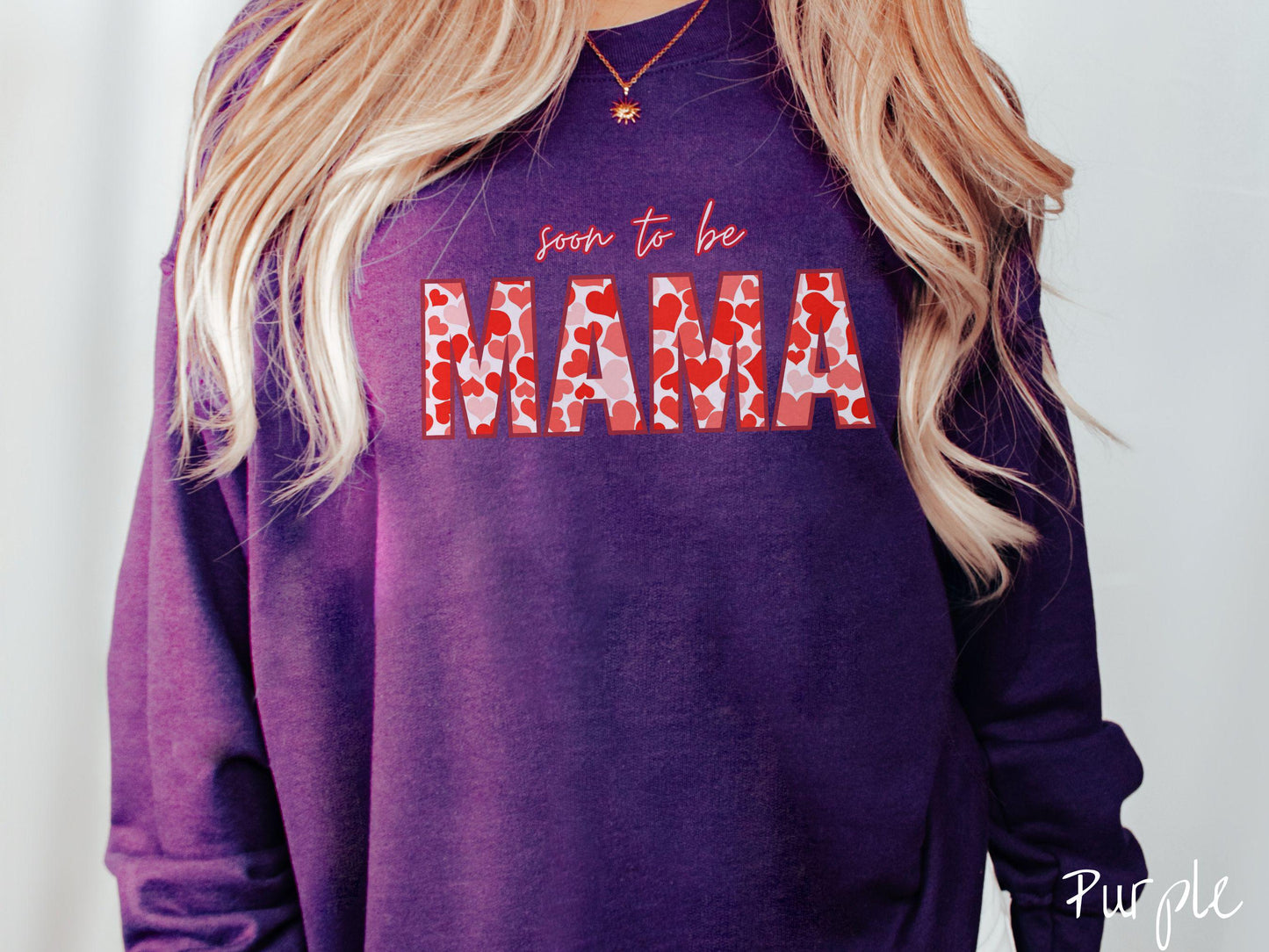 Celebrate your journey to motherhood with this vintage Gildan sweatshirt featuring the phrase “Soon to Be Mama” in bold red font, and the word “Mama” stands out in block letters filled with colorful hearts for a playful and charming touch.