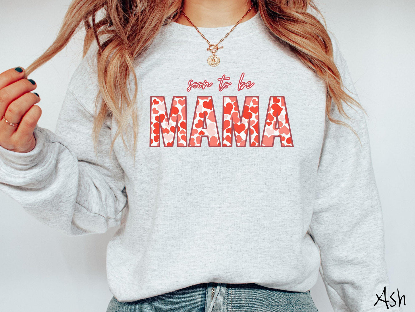 Celebrate your journey to motherhood with this vintage Gildan sweatshirt featuring the phrase “Soon to Be Mama” in bold red font, and the word “Mama” stands out in block letters filled with colorful hearts for a playful and charming touch.