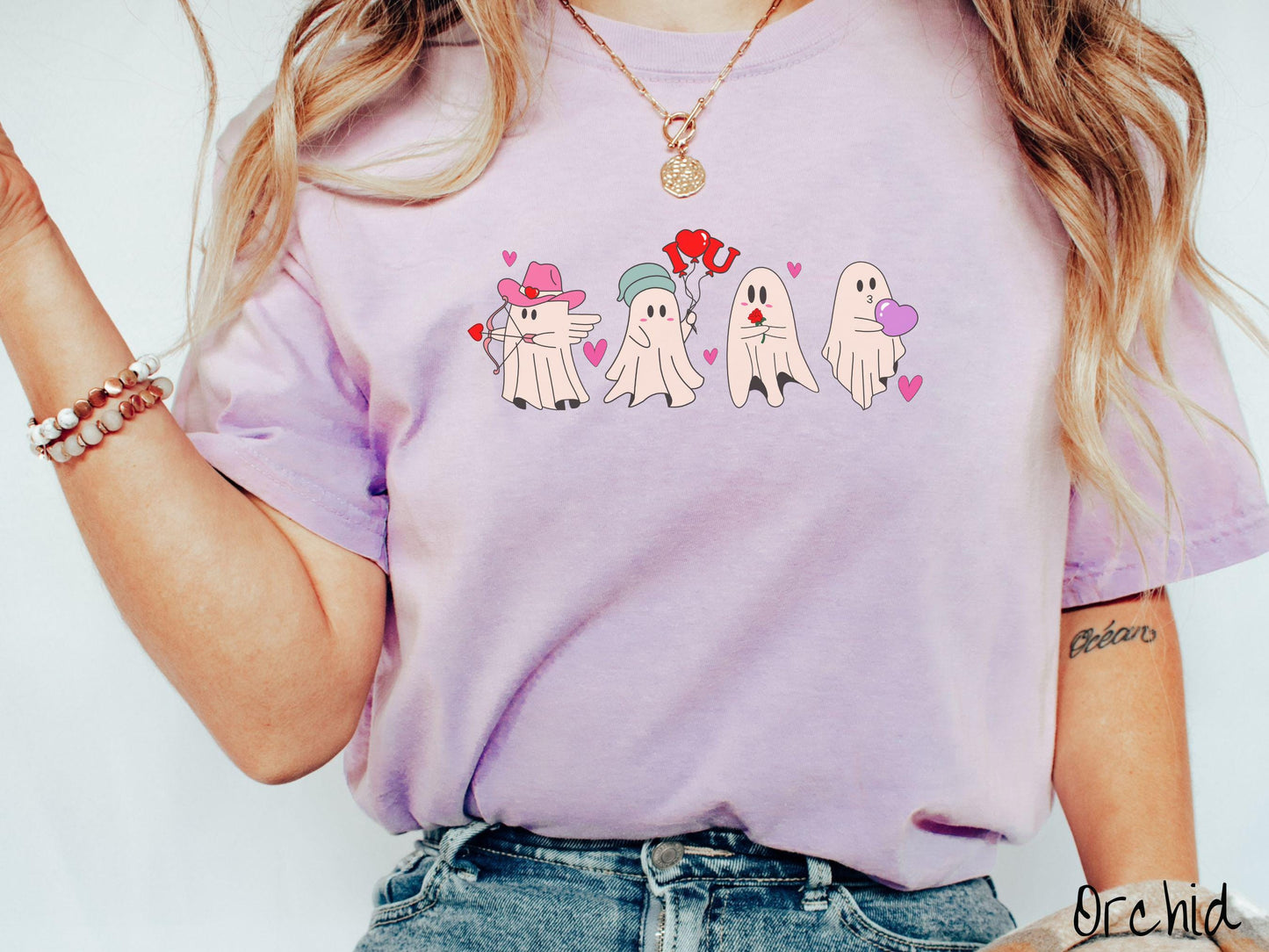 A vintage Comfort Colors t-shirt featuring four adorable ghosts with romantic details like a cowboy hat, heart-tipped arrows, "I Love You" balloons, a red rose, and a purple heart balloon, plus pink hearts for a whimsical touch.