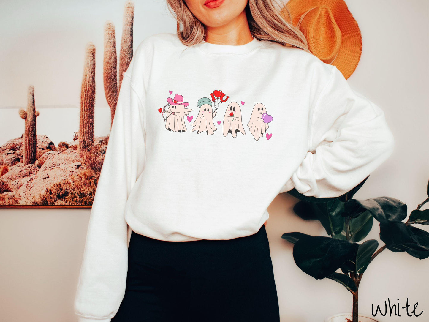 A vintage Gildan sweatshirt featuring four adorable ghosts with romantic details like a cowboy hat, heart-tipped arrows, "I Love You" balloons, a red rose, and a purple heart balloon, plus pink hearts for a whimsical touch.