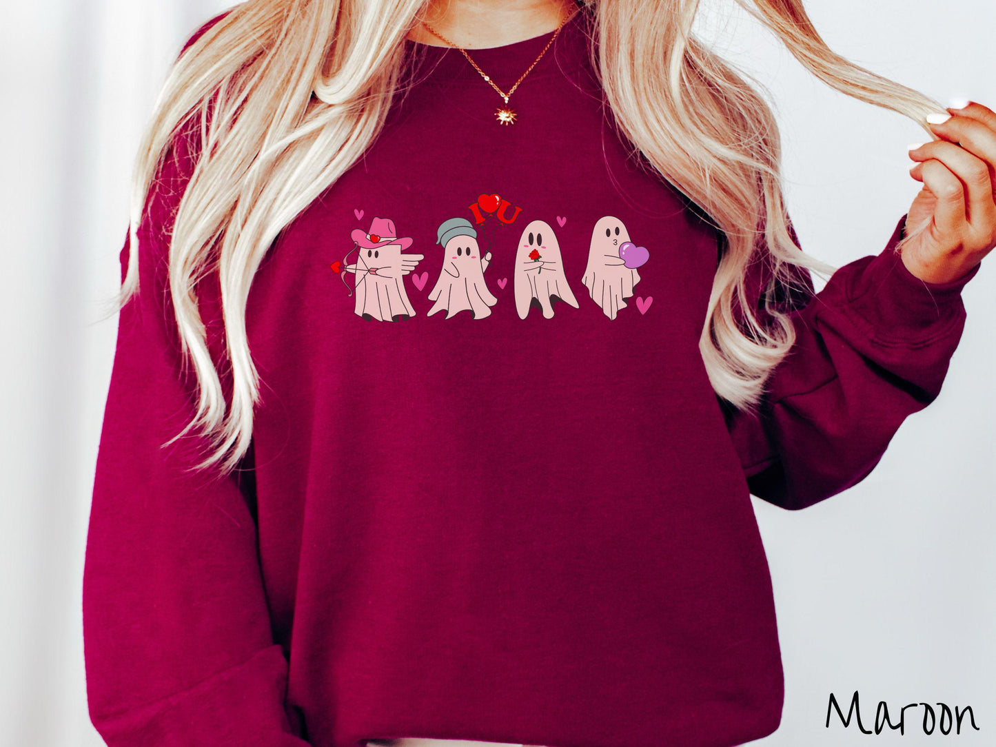 A vintage Gildan sweatshirt featuring four adorable ghosts with romantic details like a cowboy hat, heart-tipped arrows, "I Love You" balloons, a red rose, and a purple heart balloon, plus pink hearts for a whimsical touch.