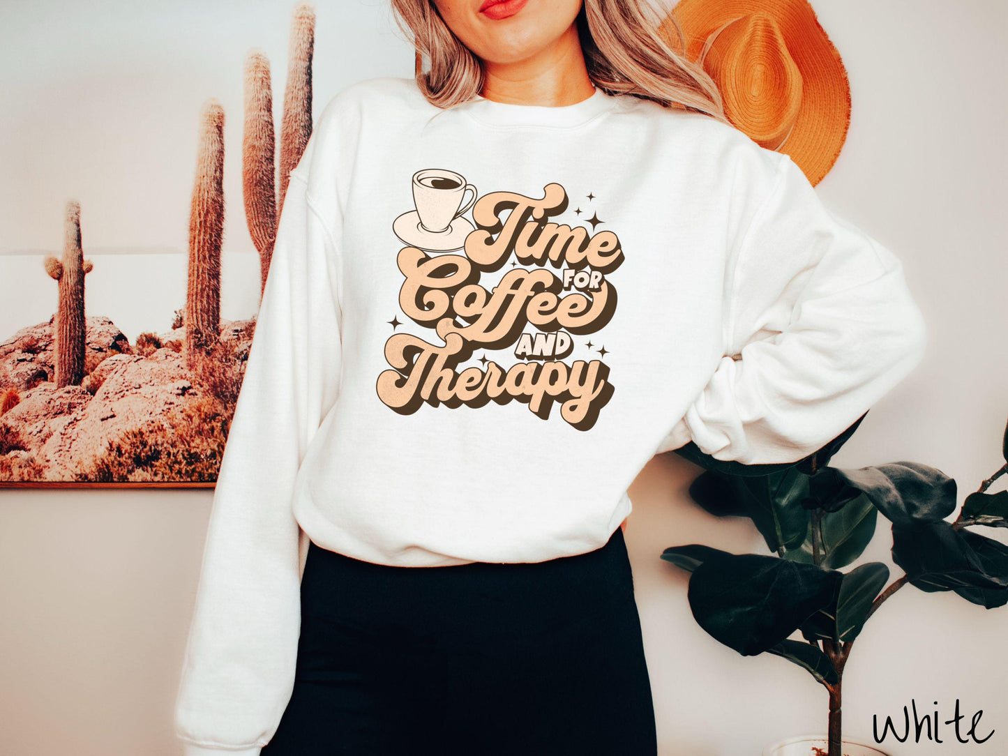 A vintage, white colored Gildan sweatshirt featuring the text Time for Coffee and Therapy with a cup of coffee and stars in the background, giving off a cozy and comforting vibe.