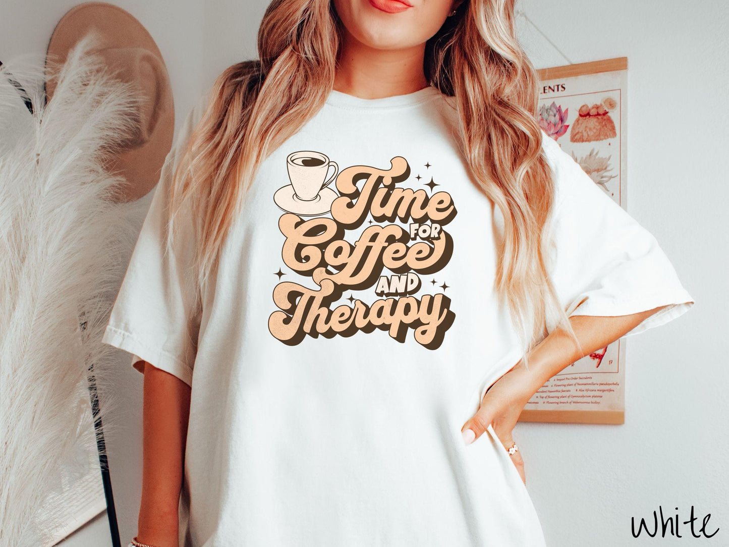 A vintage, white colored Comfort Colors t-shirt featuring the text Time for Coffee and Therapy with a cup of coffee and stars in the background, giving off a cozy and comforting vibe.
