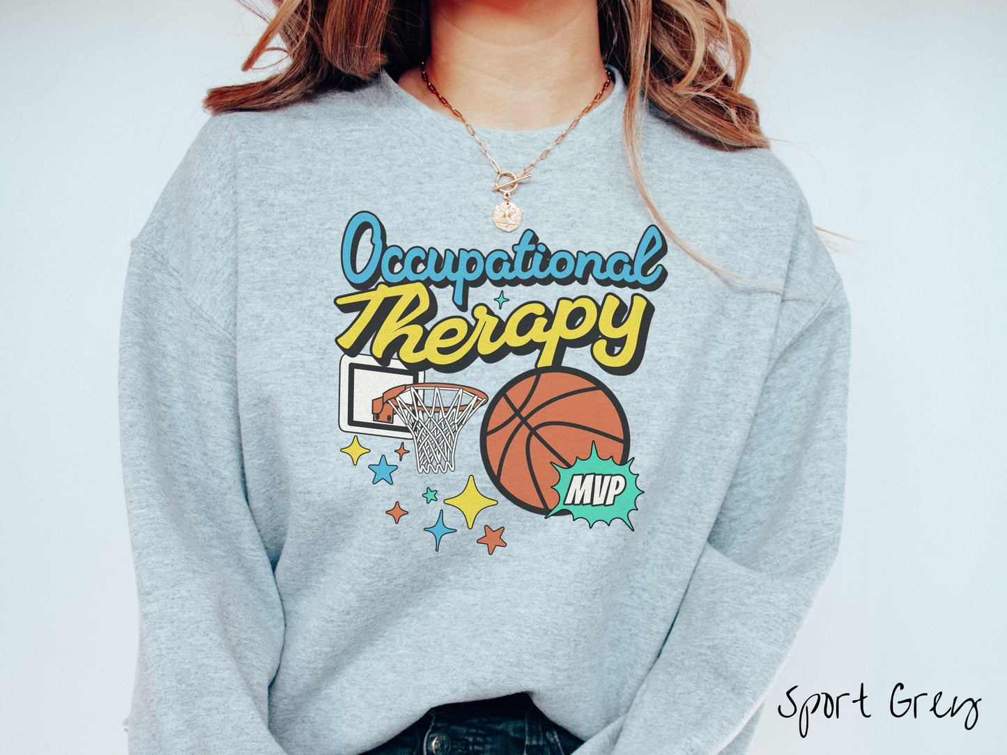 A vintage, sport grey colored Gildan sweatshirt features the phrase "Occupational Therapy" above a basketball goal, complemented by a bold basketball graphic with the text "MVP".