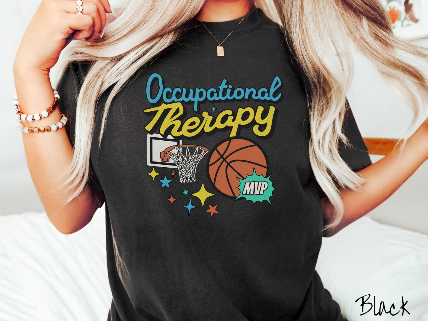 A vintage, black colored Comfort Colors T-Shirt features the phrase "Occupational Therapy" above a basketball goal, complemented by a bold basketball graphic with the text "MVP".