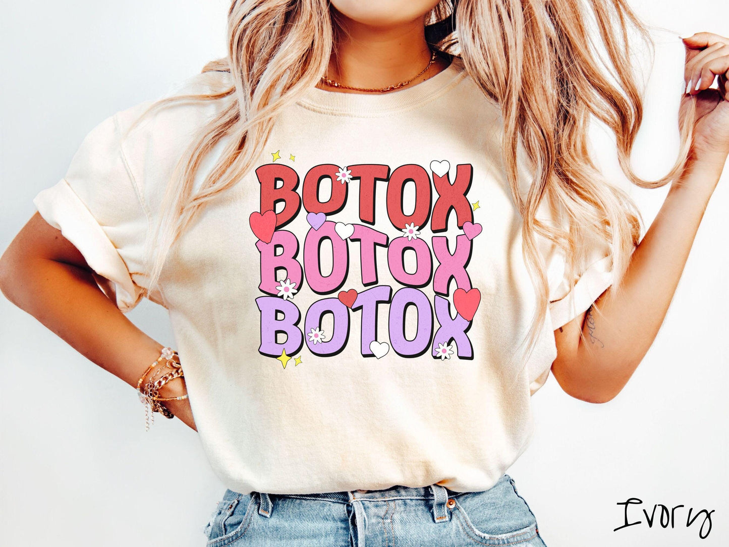 A vibrant Comfort Colors T-shirt with the text BOTOX written three times vertically, accompanied by tiny hearts, stars, and flowers. The perfect gift for friends who are into cosmetic botox nursing.
