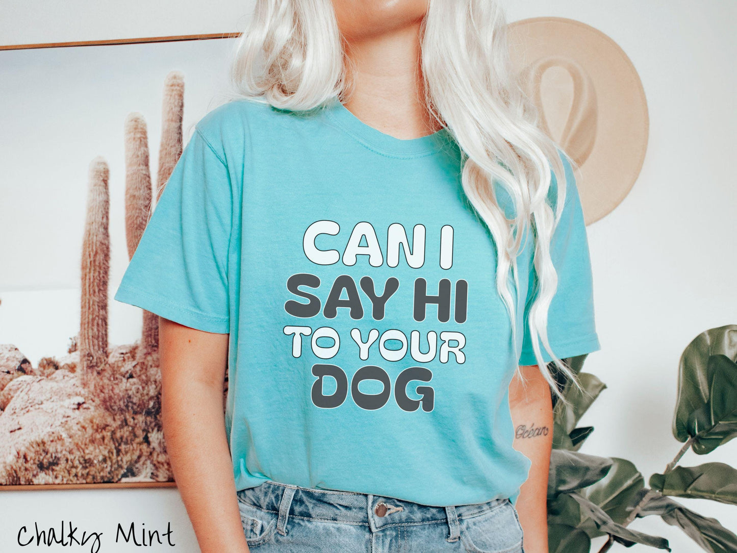 This vintage Comfort Colors t-shirt is perfect for dog lovers who want to make a bold statement. Featuring the text "CAN I SAY HI TO YOUR DOG" in uppercase black and white font, this shirt combines comfort and style with a playful message.