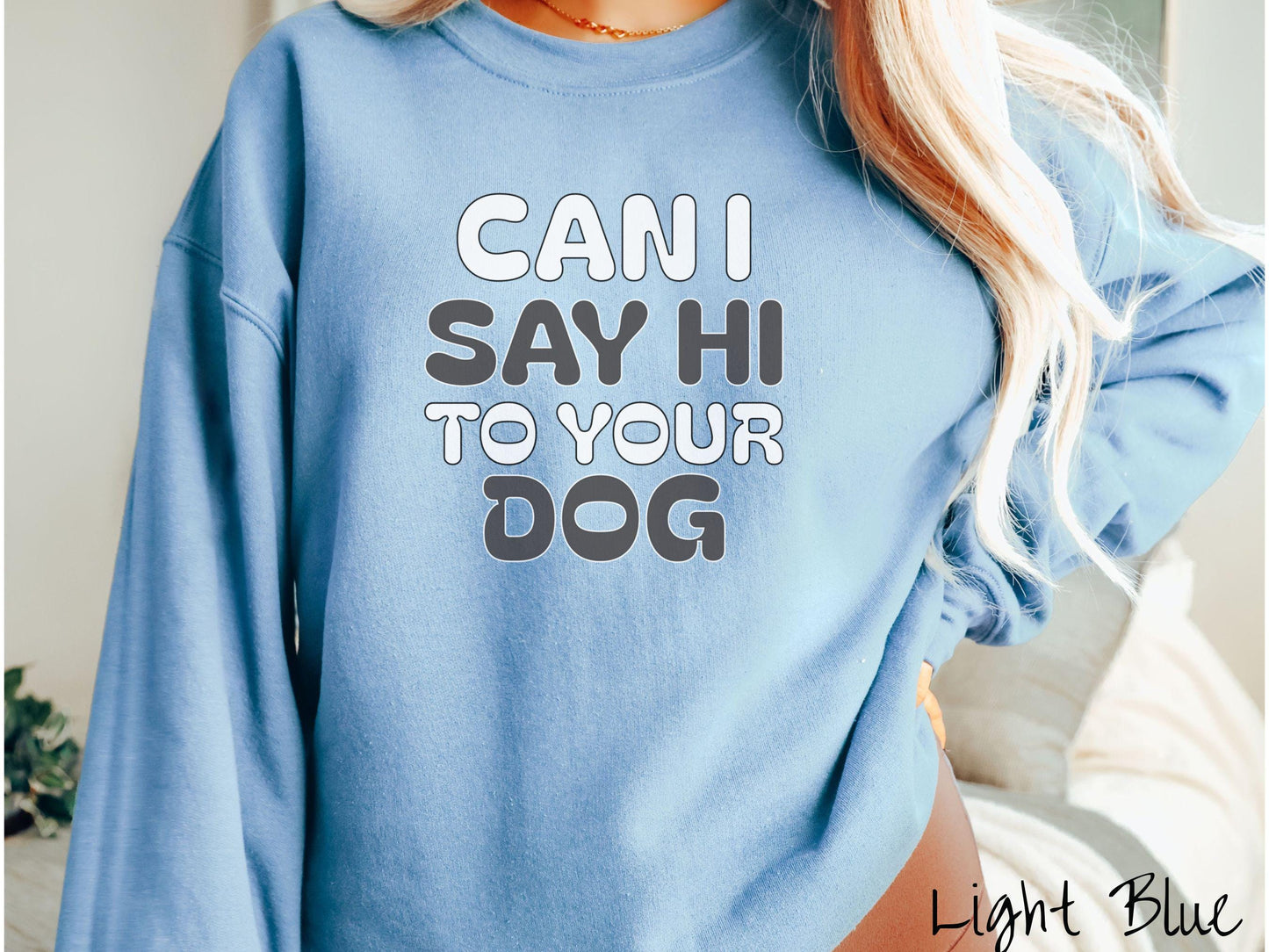 This vintage Gildan sweatshirt is perfect for dog lovers who want to make a bold statement. Featuring the text "CAN I SAY HI TO YOUR DOG" in uppercase black and white font, this sweater combines comfort and style with a playful message.