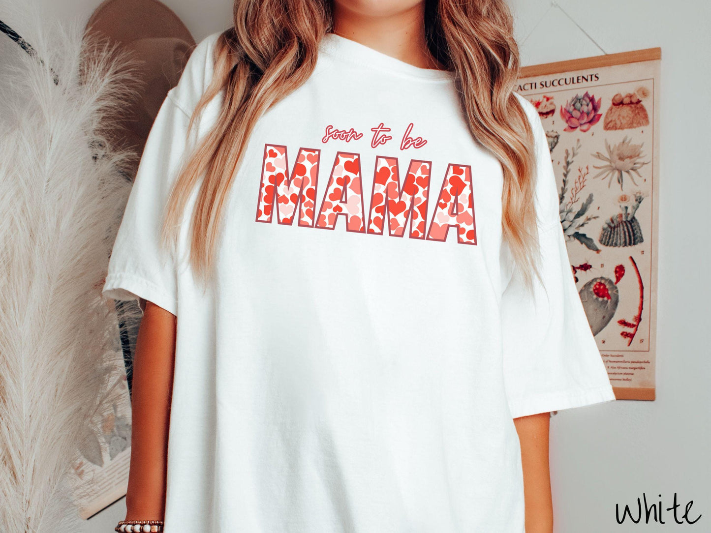 Celebrate your journey to motherhood with this vintage Comfort Colors t-shirt featuring the phrase “Soon to Be Mama” in bold red font, and the word “Mama” stands out in block letters filled with colorful hearts for a playful and charming touch.