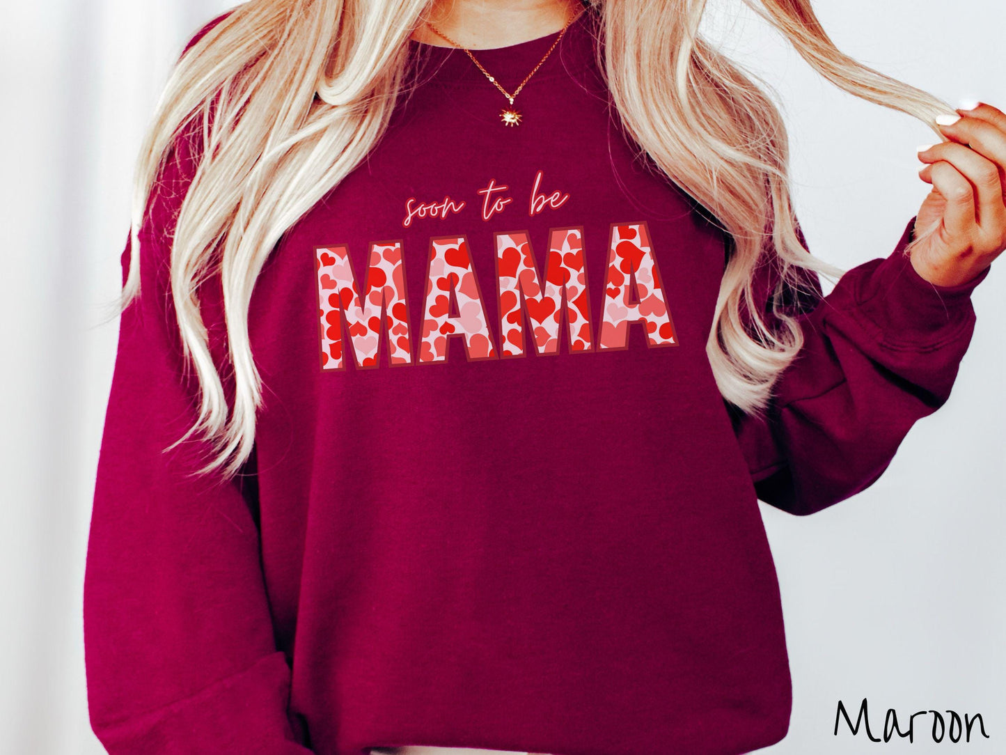 Celebrate your journey to motherhood with this vintage Gildan sweatshirt featuring the phrase “Soon to Be Mama” in bold red font, and the word “Mama” stands out in block letters filled with colorful hearts for a playful and charming touch.