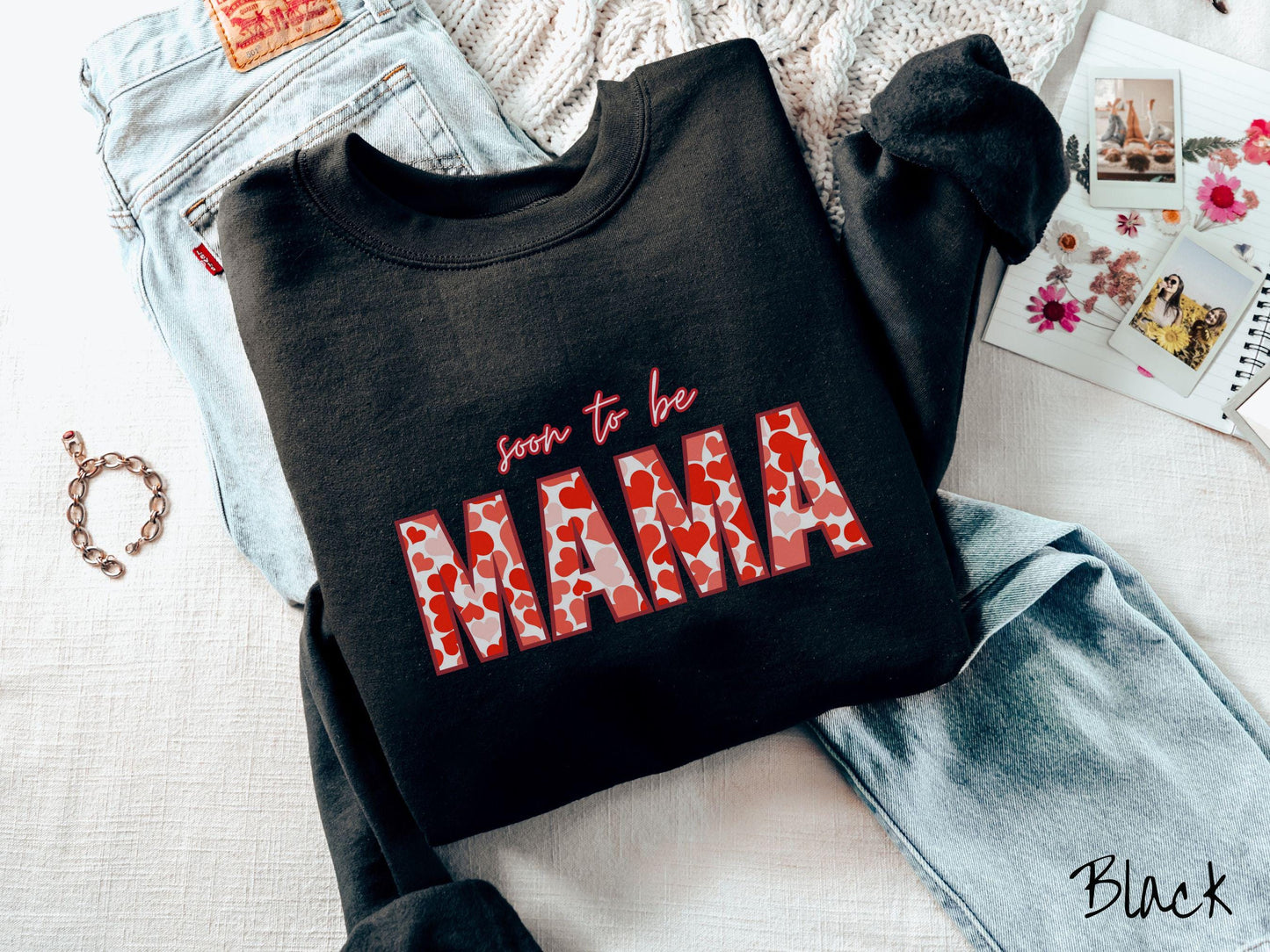 Celebrate your journey to motherhood with this vintage Gildan sweatshirt featuring the phrase “Soon to Be Mama” in bold red font, and the word “Mama” stands out in block letters filled with colorful hearts for a playful and charming touch.