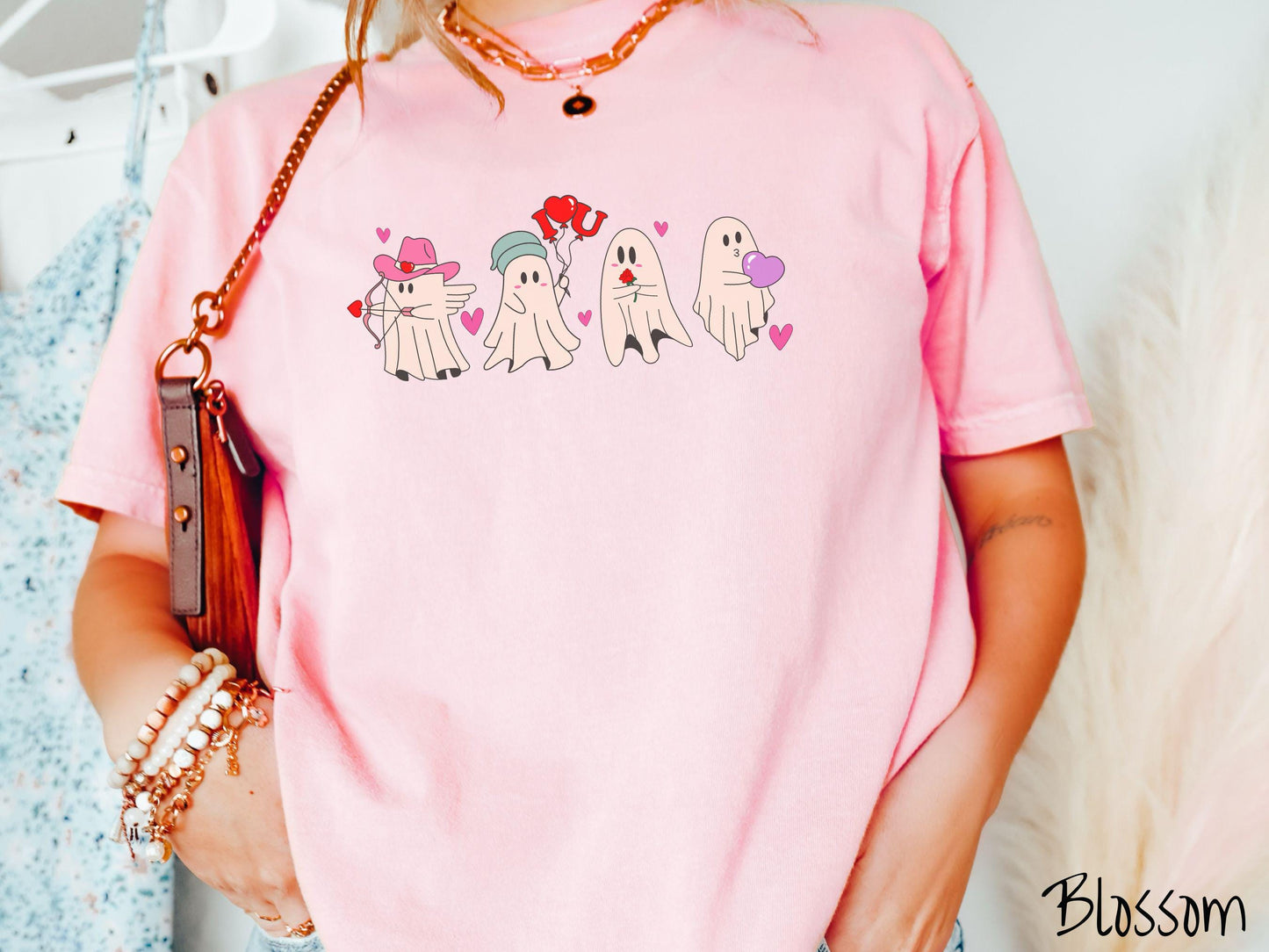 A vintage Comfort Colors t-shirt featuring four adorable ghosts with romantic details like a cowboy hat, heart-tipped arrows, "I Love You" balloons, a red rose, and a purple heart balloon, plus pink hearts for a whimsical touch.