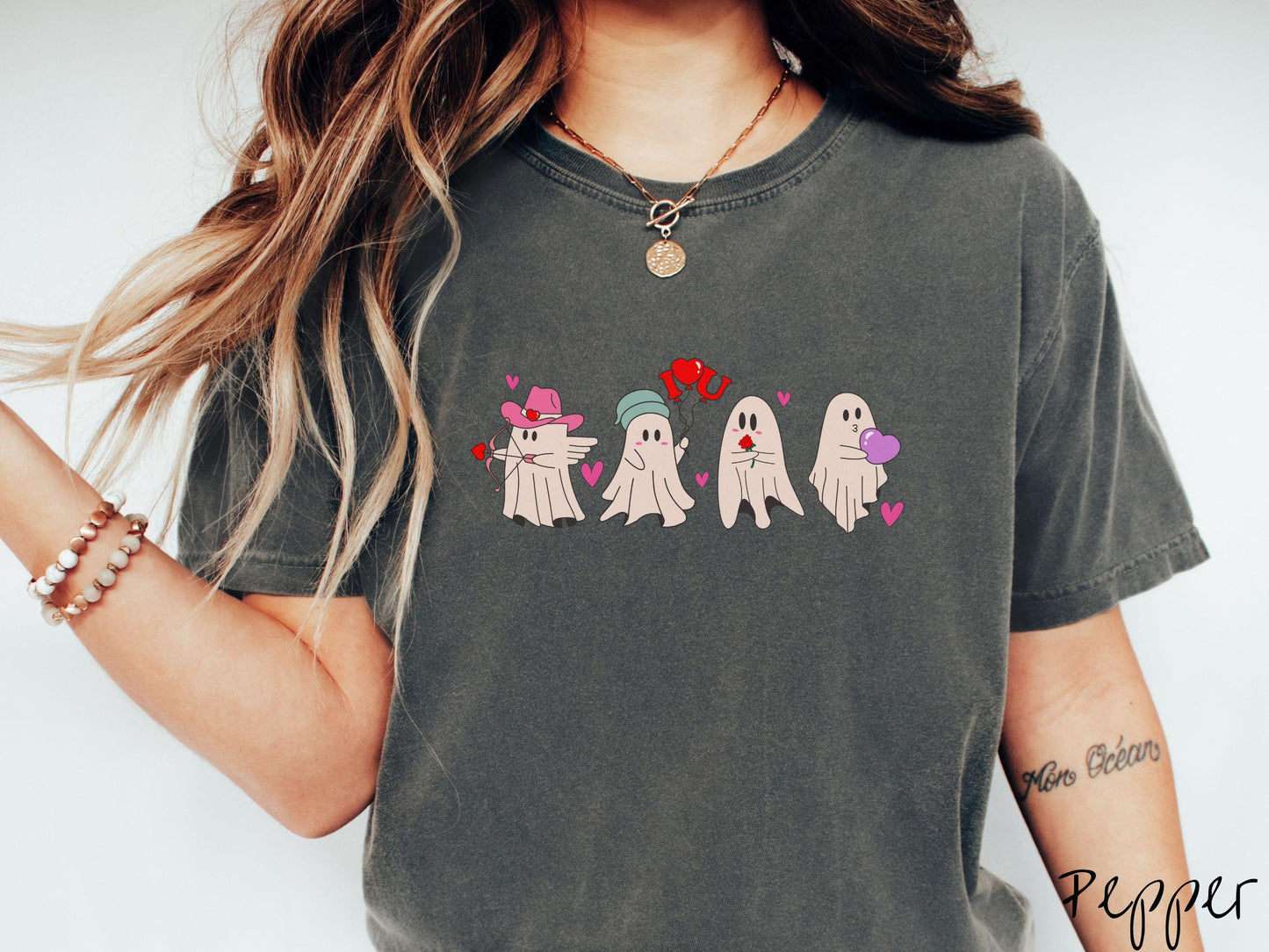 A vintage Comfort Colors t-shirt featuring four adorable ghosts with romantic details like a cowboy hat, heart-tipped arrows, "I Love You" balloons, a red rose, and a purple heart balloon, plus pink hearts for a whimsical touch.