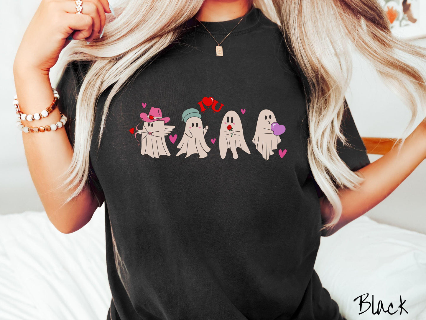 A vintage Comfort Colors t-shirt featuring four adorable ghosts with romantic details like a cowboy hat, heart-tipped arrows, "I Love You" balloons, a red rose, and a purple heart balloon, plus pink hearts for a whimsical touch.