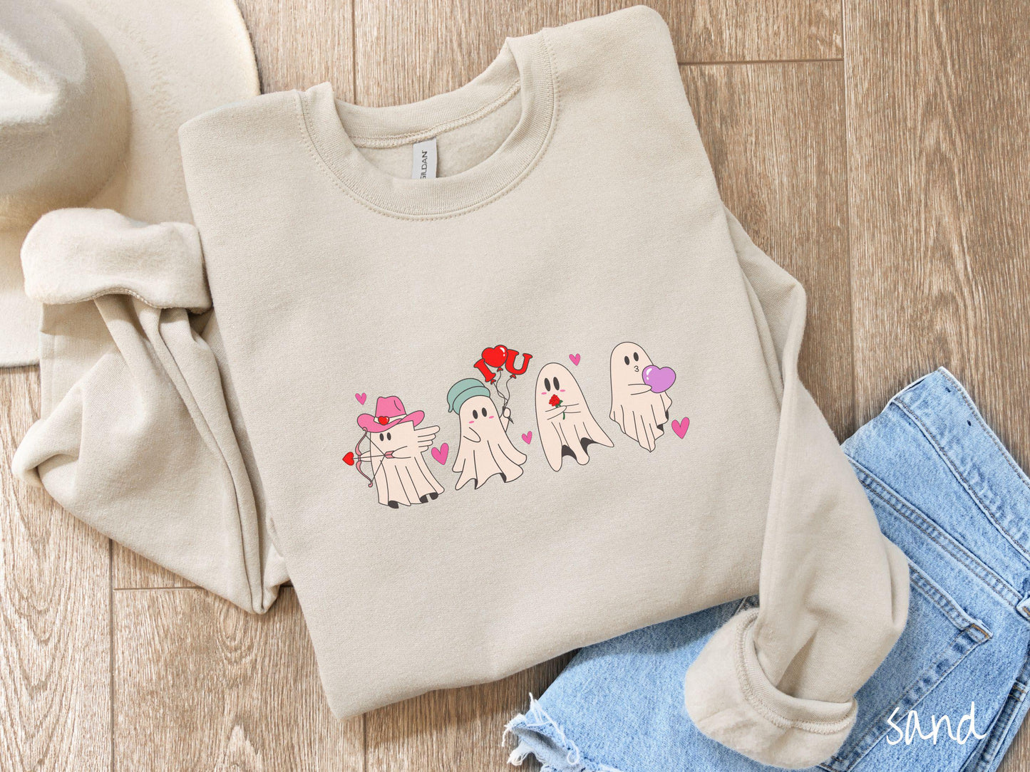 A vintage Gildan sweatshirt featuring four adorable ghosts with romantic details like a cowboy hat, heart-tipped arrows, "I Love You" balloons, a red rose, and a purple heart balloon, plus pink hearts for a whimsical touch.