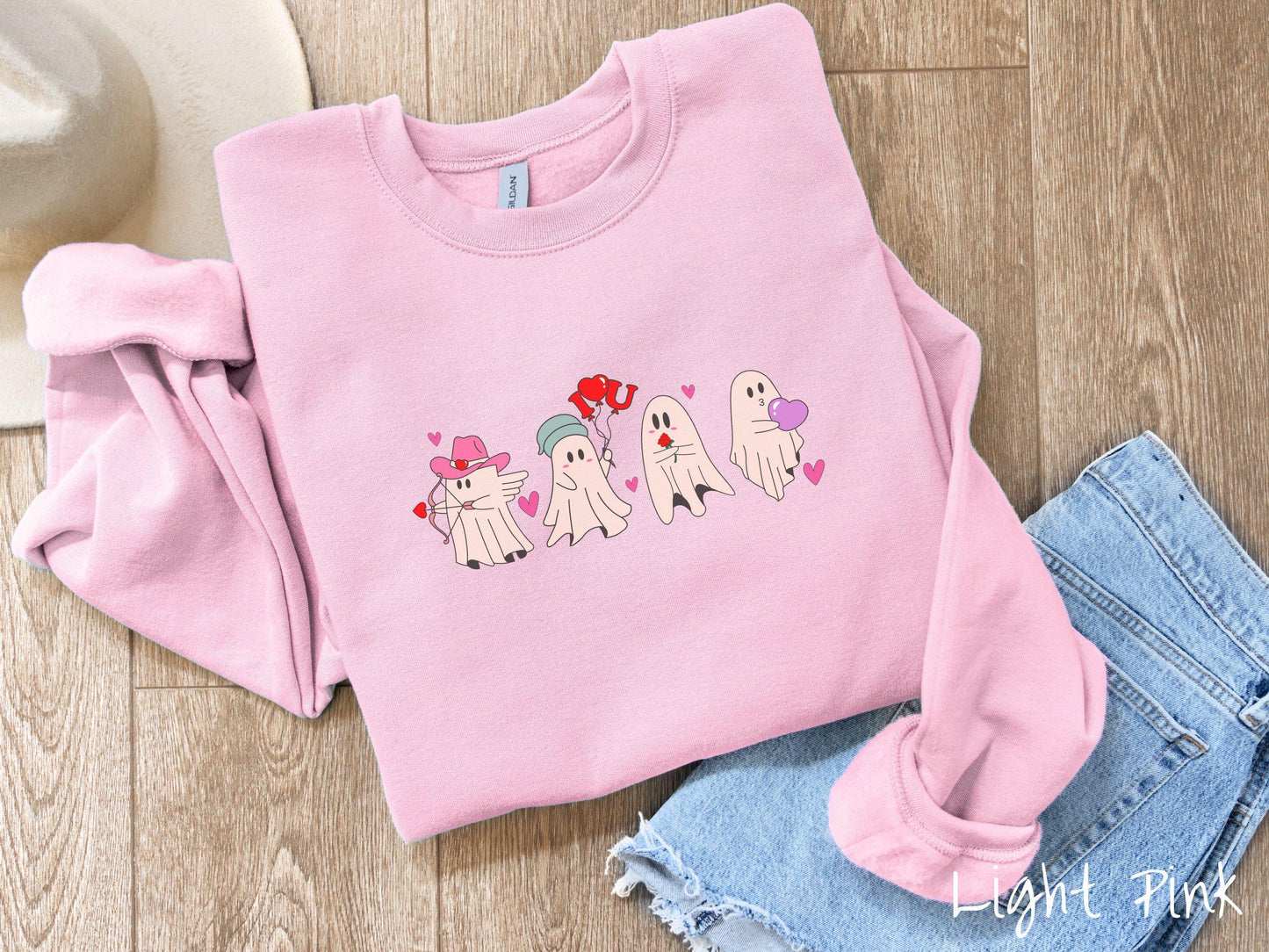 A vintage Gildan sweatshirt featuring four adorable ghosts with romantic details like a cowboy hat, heart-tipped arrows, "I Love You" balloons, a red rose, and a purple heart balloon, plus pink hearts for a whimsical touch.
