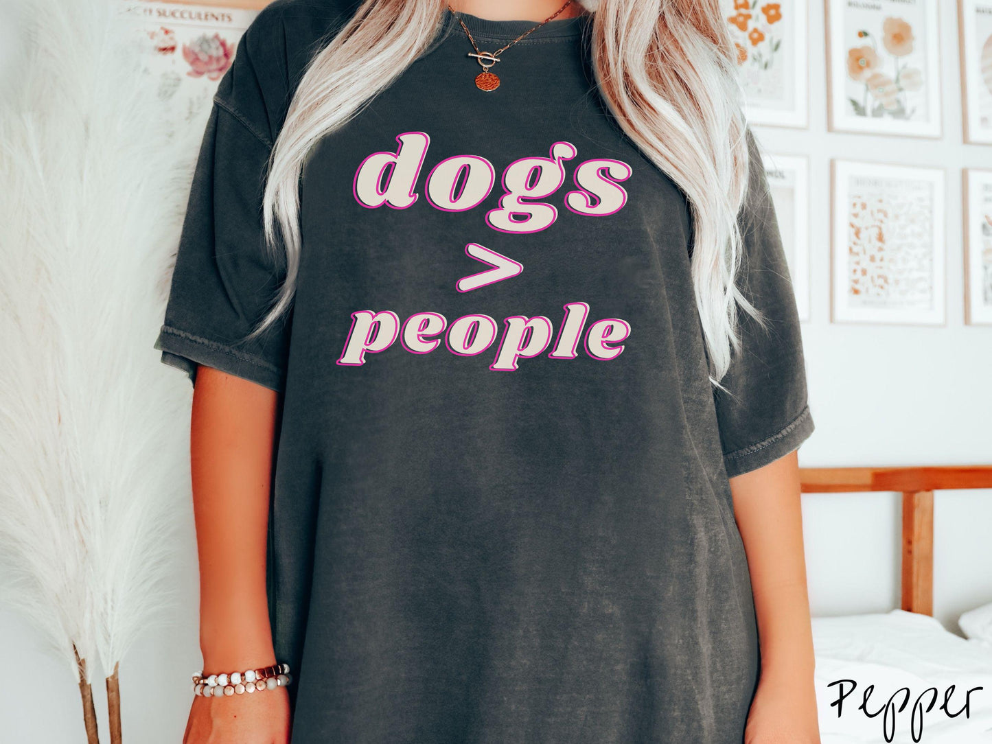A vintage Comfort Colors t-shirt is perfect for dog lovers who know that dogs are greater than people! Featuring the funny saying Dogs > People, this tee is a must-have for anyone who prefers the company of their furry friends over humans.