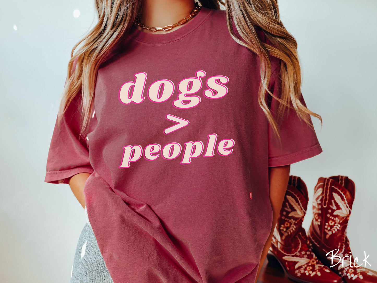 A vintage Comfort Colors t-shirt is perfect for dog lovers who know that dogs are greater than people! Featuring the funny saying Dogs > People, this tee is a must-have for anyone who prefers the company of their furry friends over humans.