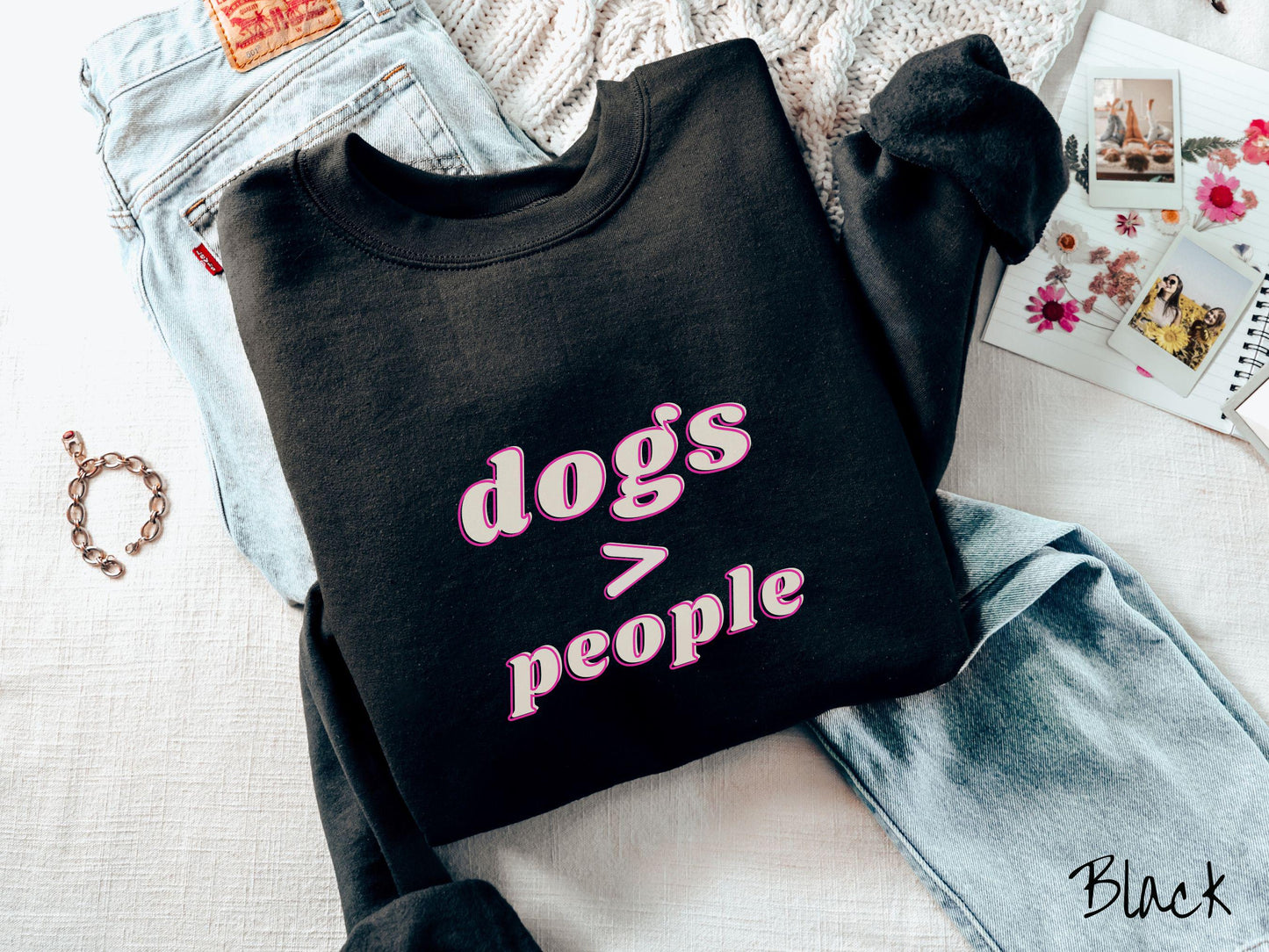 A vintage Gildan sweatshirt is perfect for dog lovers who know that dogs are greater than people! Featuring the funny saying Dogs > People, this tee is a must-have for anyone who prefers the company of their furry friends over humans.