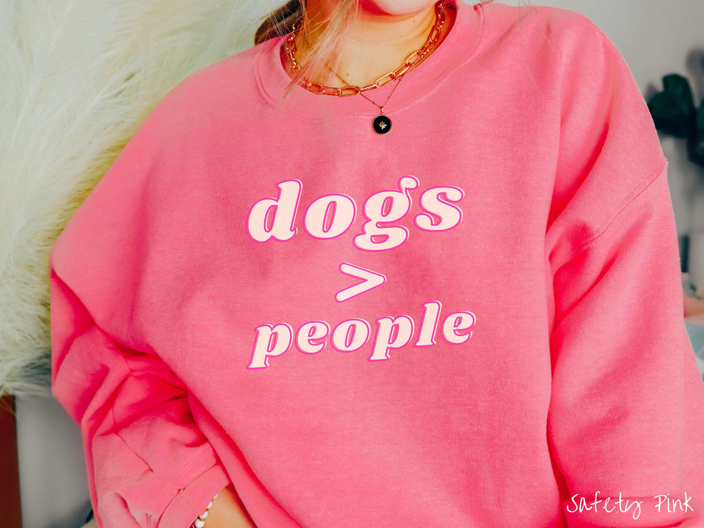 A vintage Gildan sweatshirt is perfect for dog lovers who know that dogs are greater than people! Featuring the funny saying Dogs > People, this tee is a must-have for anyone who prefers the company of their furry friends over humans.