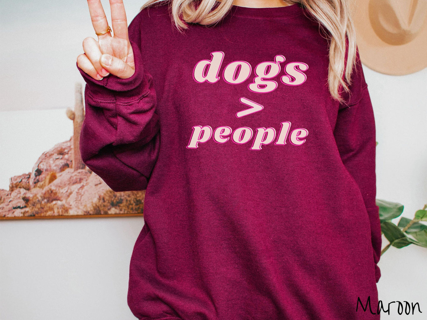 A vintage Gildan sweatshirt is perfect for dog lovers who know that dogs are greater than people! Featuring the funny saying Dogs > People, this tee is a must-have for anyone who prefers the company of their furry friends over humans.