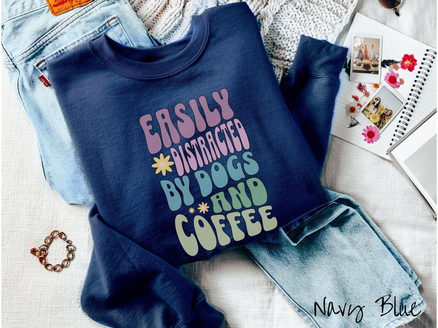 This vintage Gildan sweatshirt is a must-have for anyone who loves dogs, coffee, and a touch of humor! Featuring the funny saying Easily Distracted by Dogs and Coffee in vibrant, round font, this design adds a playful vibe to your wardrobe.