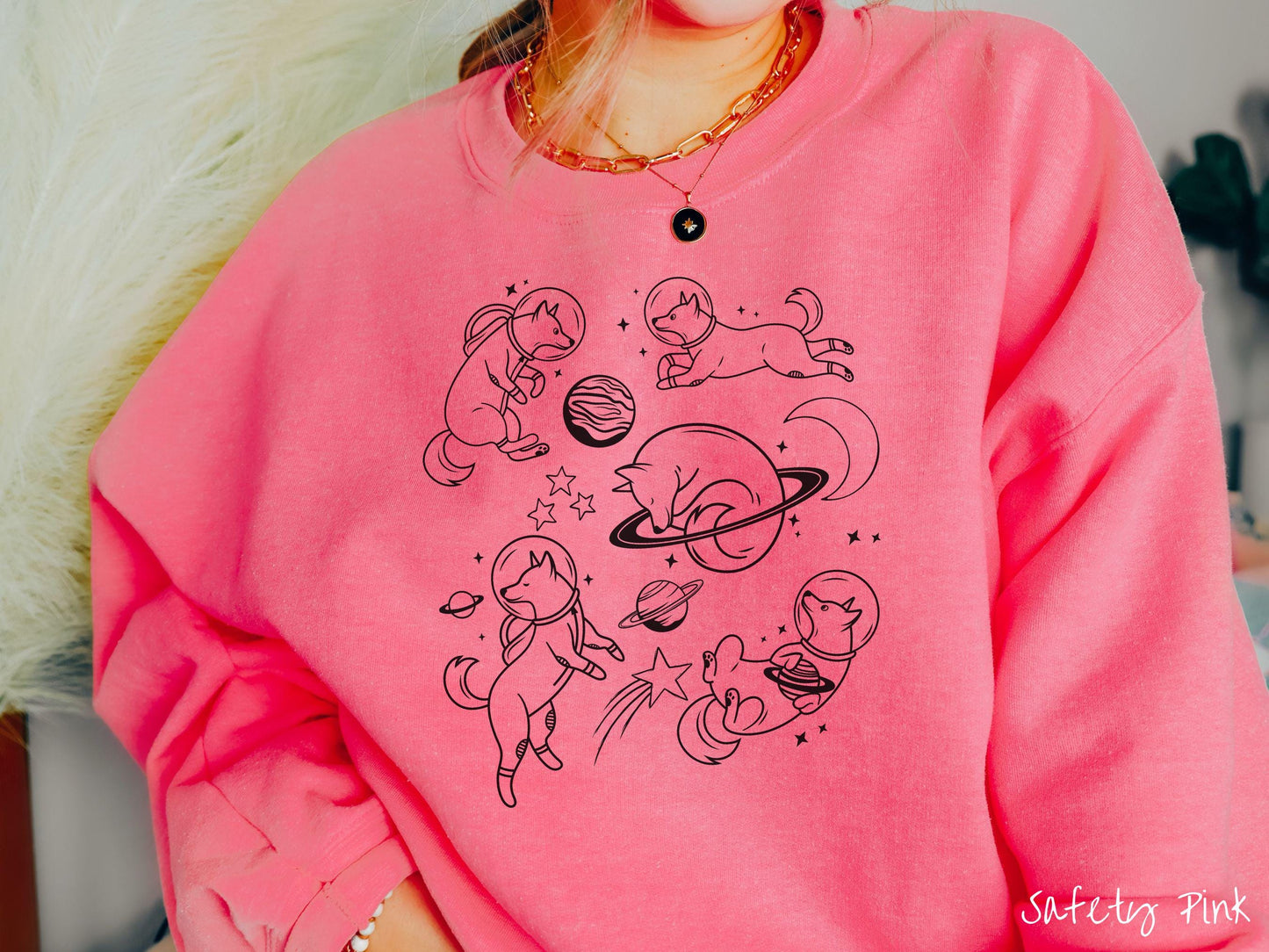 A vintage Gildan sweatshirt perfect for dog lovers and space enthusiasts alike, featuring outline designs of dogs in astronaut bubble helmets. This design showcases pups floating in the solar system, surrounded by stars, the moon, and planets.