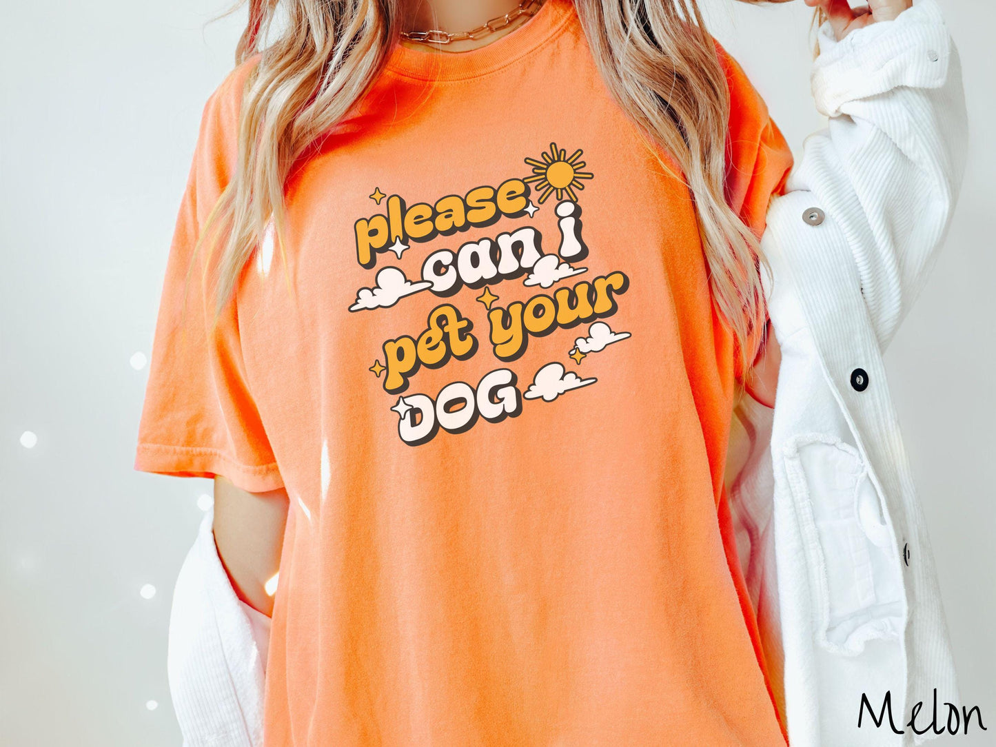 A vintage Comfort Colors t-shirt perfect for dog lovers who just can’t resist asking, “Please, can I pet your dog?” Featuring this fun phrase in orange and white font, this sweatshirt is a must-have for anyone who loves petting every pup they see.