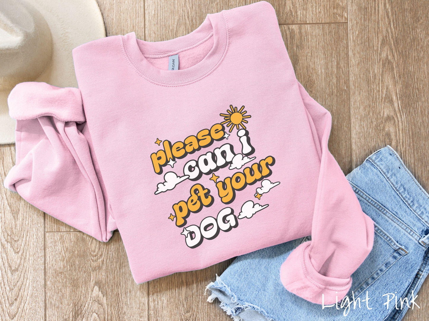 This cozy Gildan sweatshirt is perfect for dog lovers who just can’t resist asking, “Please, can I pet your dog?” Featuring this fun phrase in orange and white font, this sweatshirt is a must-have for anyone who loves petting every pup they see.
