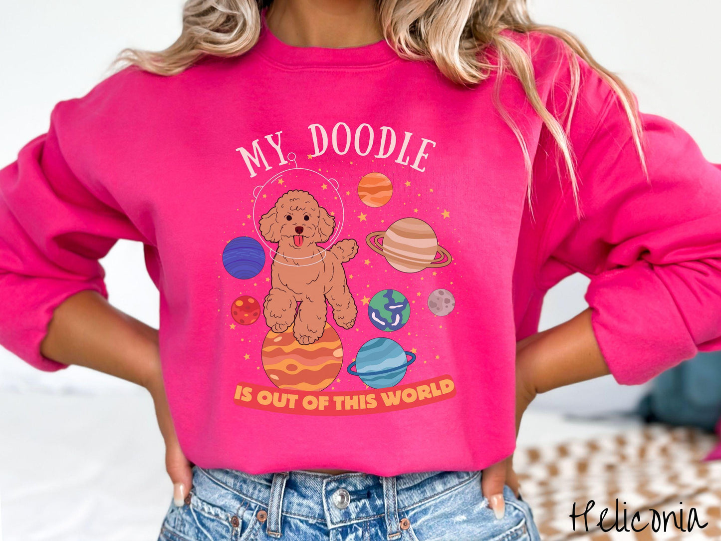A vintage Gildan sweatshirt featuring the text My Doodle is Out of This World. The design showcases a German Shepherd sitting proudly atop Jupiter, surrounded by a vibrant solar system filled with colorful planets and twinkling stars.