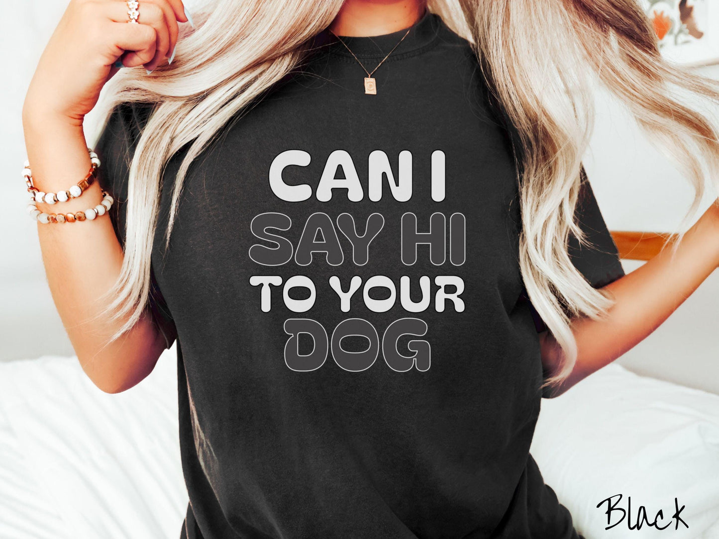 This vintage Comfort Colors t-shirt is perfect for dog lovers who want to make a bold statement. Featuring the text "CAN I SAY HI TO YOUR DOG" in uppercase black and white font, this shirt combines comfort and style with a playful message.