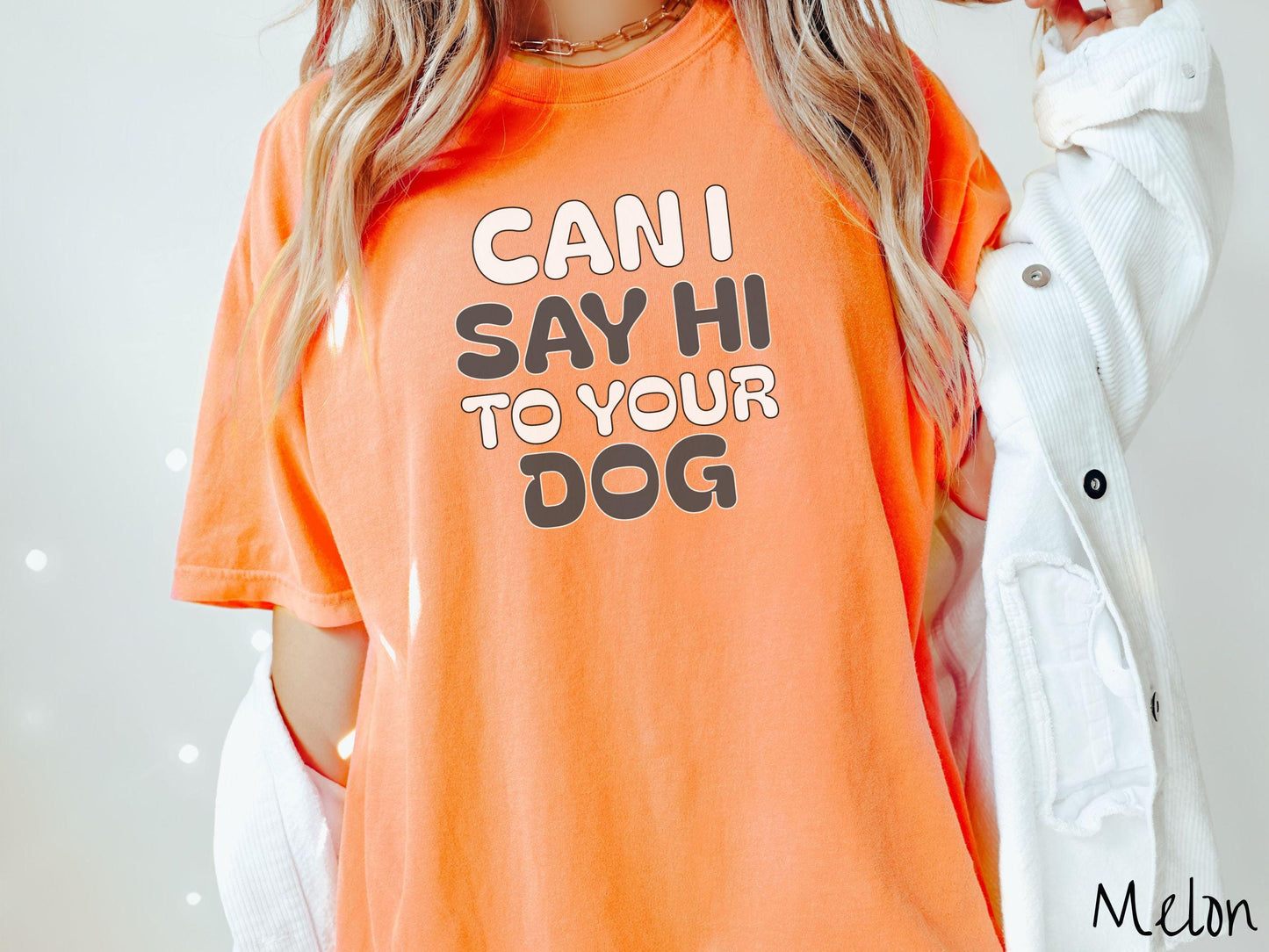 This vintage Comfort Colors t-shirt is perfect for dog lovers who want to make a bold statement. Featuring the text "CAN I SAY HI TO YOUR DOG" in uppercase black and white font, this shirt combines comfort and style with a playful message.