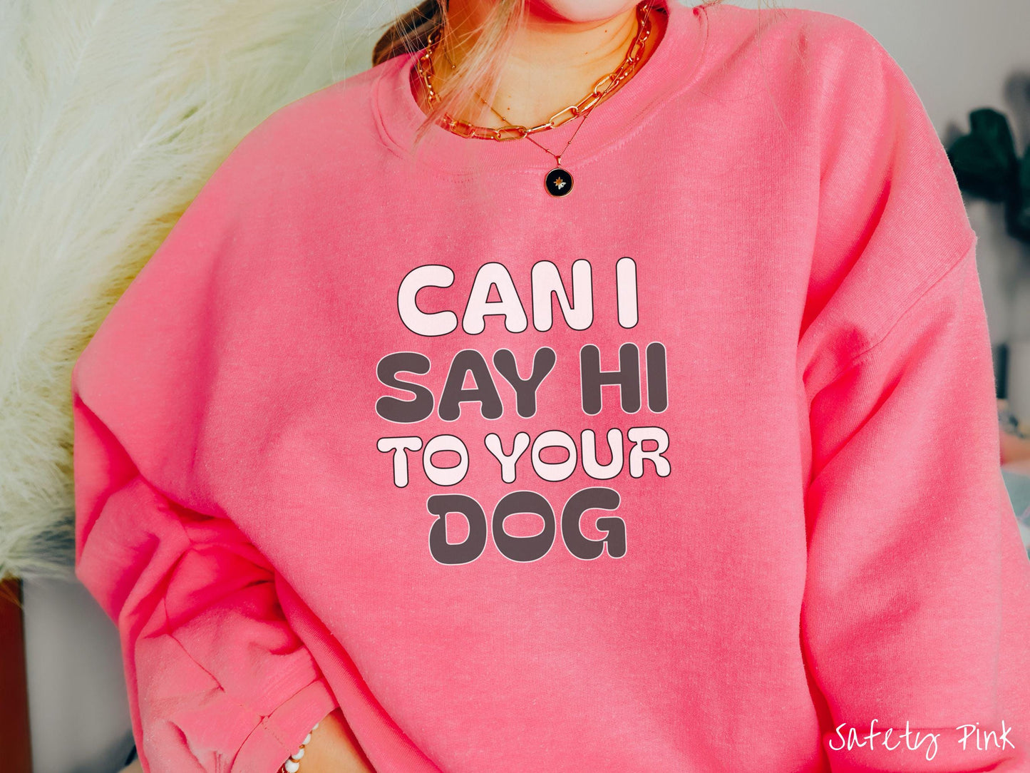 This vintage Gildan sweatshirt is perfect for dog lovers who want to make a bold statement. Featuring the text "CAN I SAY HI TO YOUR DOG" in uppercase black and white font, this sweater combines comfort and style with a playful message.