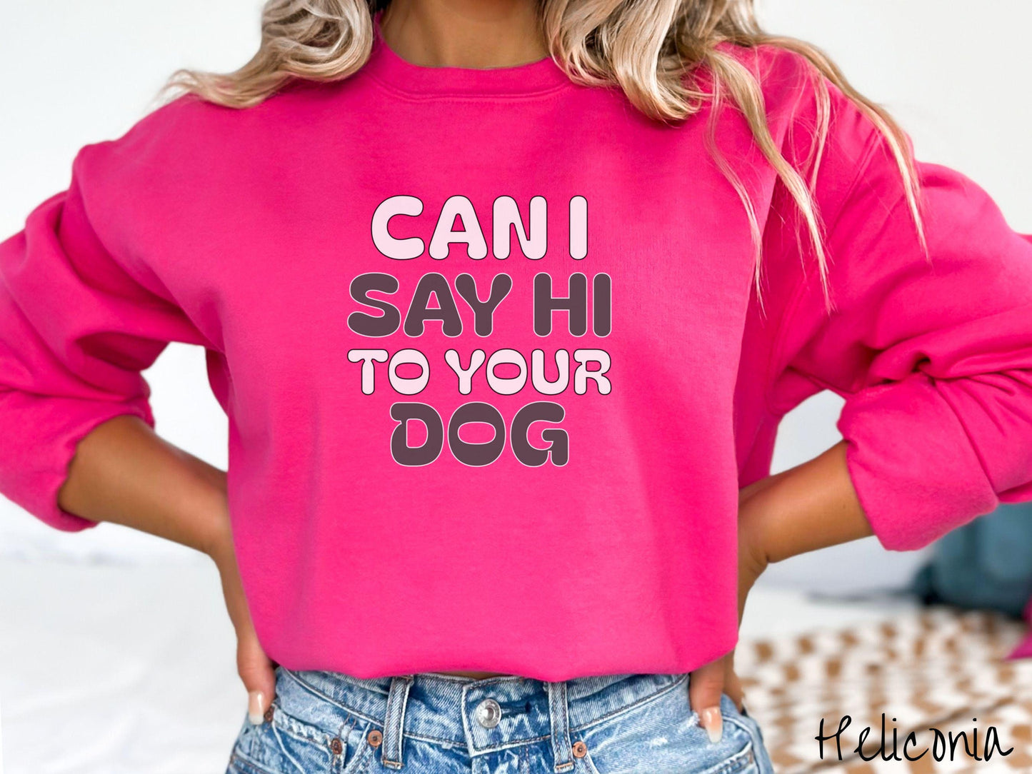 This vintage Gildan sweatshirt is perfect for dog lovers who want to make a bold statement. Featuring the text "CAN I SAY HI TO YOUR DOG" in uppercase black and white font, this sweater combines comfort and style with a playful message.