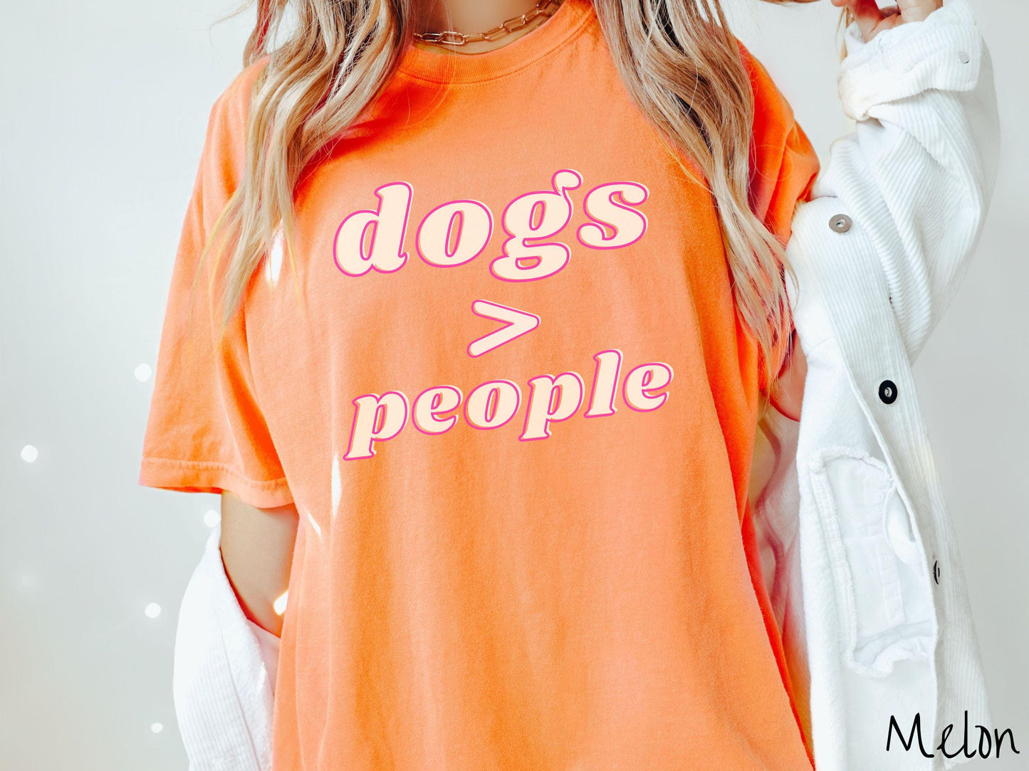 A vintage Comfort Colors t-shirt is perfect for dog lovers who know that dogs are greater than people! Featuring the funny saying Dogs > People, this tee is a must-have for anyone who prefers the company of their furry friends over humans.