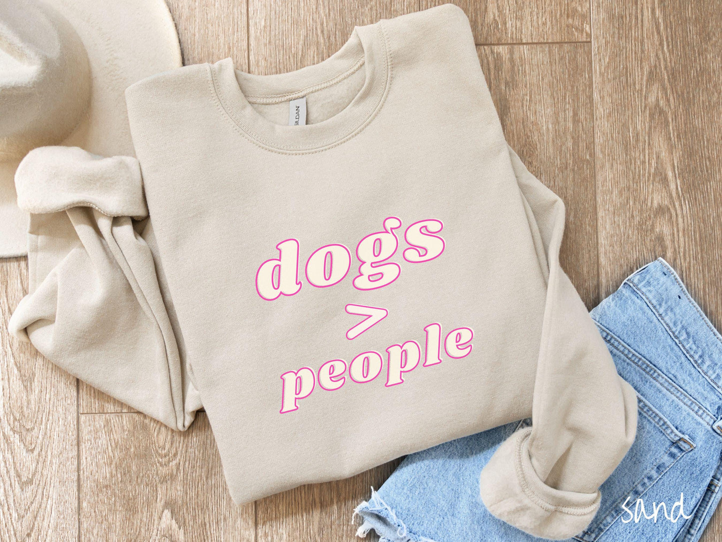 A vintage Gildan sweatshirt is perfect for dog lovers who know that dogs are greater than people! Featuring the funny saying Dogs > People, this tee is a must-have for anyone who prefers the company of their furry friends over humans.
