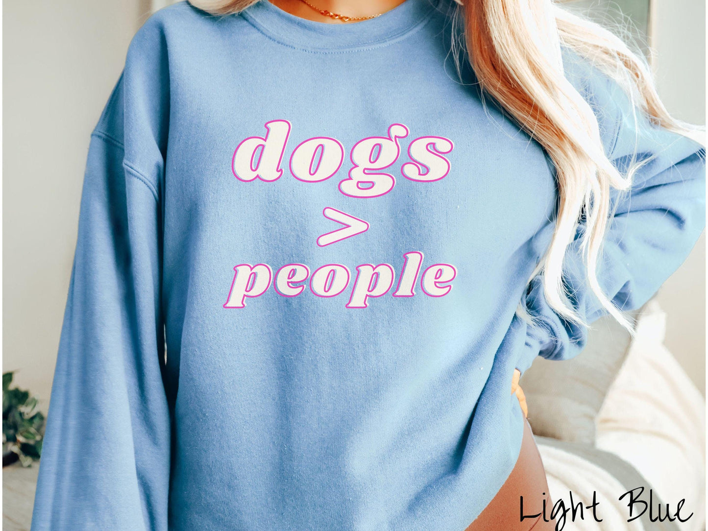 A vintage Gildan sweatshirt is perfect for dog lovers who know that dogs are greater than people! Featuring the funny saying Dogs > People, this tee is a must-have for anyone who prefers the company of their furry friends over humans.