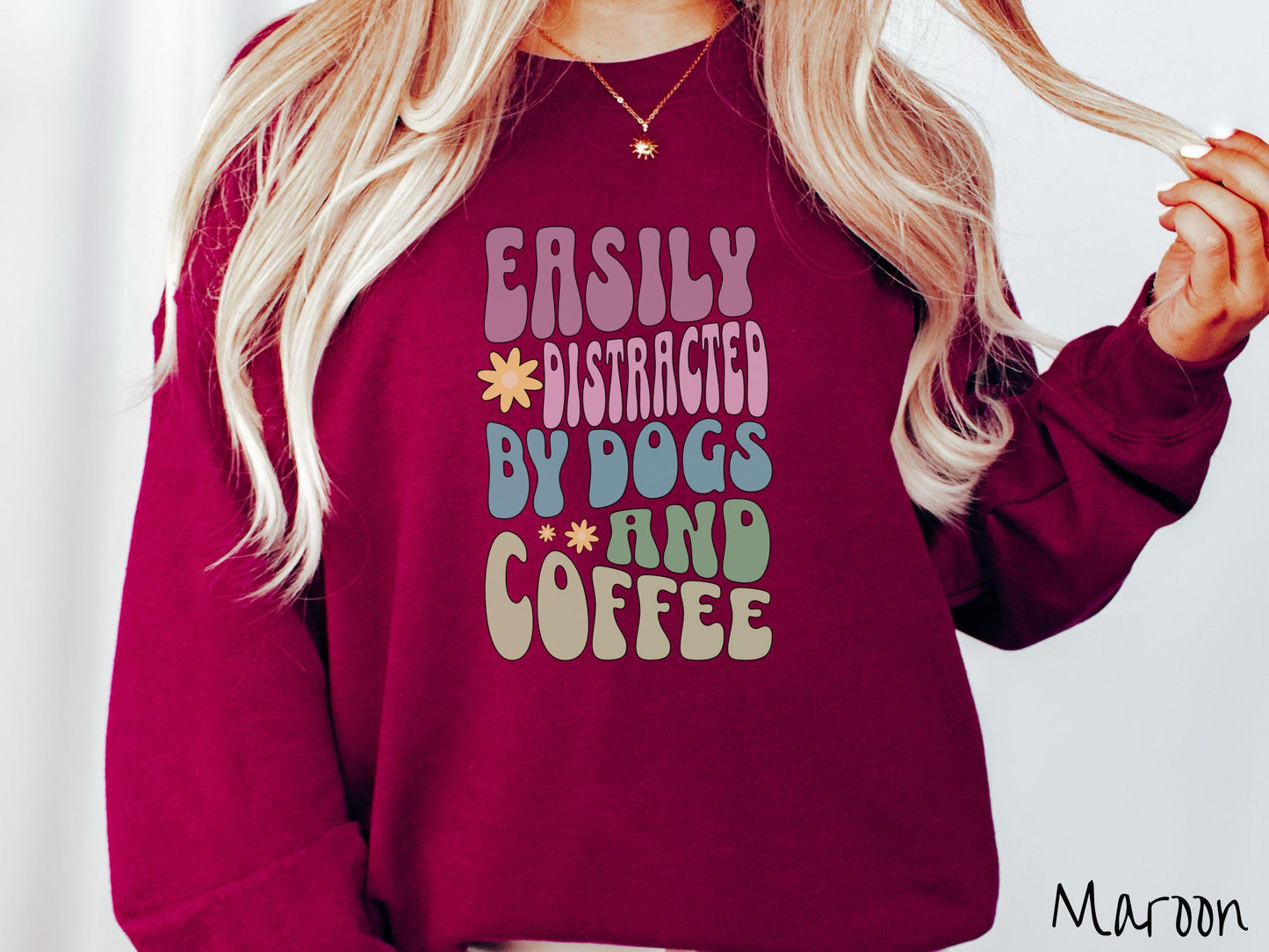 This vintage Gildan sweatshirt is a must-have for anyone who loves dogs, coffee, and a touch of humor! Featuring the funny saying Easily Distracted by Dogs and Coffee in vibrant, round font, this design adds a playful vibe to your wardrobe.