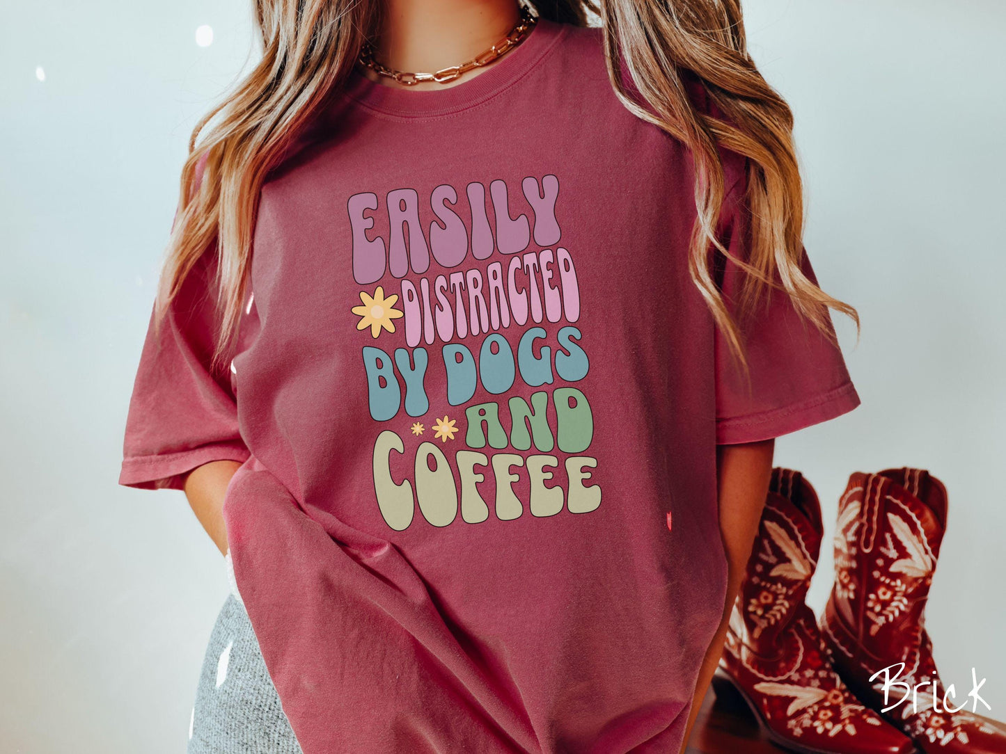 This vintage Comfort Colors t-shirt is a must-have for anyone who loves dogs, coffee, and a touch of humor! Featuring the funny saying Easily Distracted by Dogs and Coffee in vibrant, round font, this design adds a playful vibe to your wardrobe.