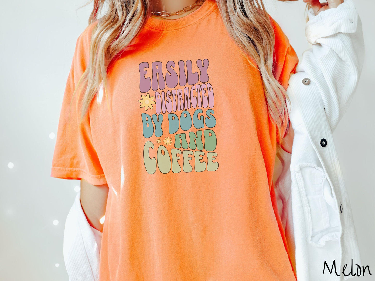 This vintage Comfort Colors t-shirt is a must-have for anyone who loves dogs, coffee, and a touch of humor! Featuring the funny saying Easily Distracted by Dogs and Coffee in vibrant, round font, this design adds a playful vibe to your wardrobe.