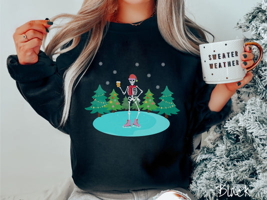 A woman wearing a vintage, black colored sweatshirt with a female skeleton wearing a red Santa hat, red scarf, red and pink ice skates, and holding a coffee, ice skating on a pond at night with snowflakes and Christmas trees in the background.